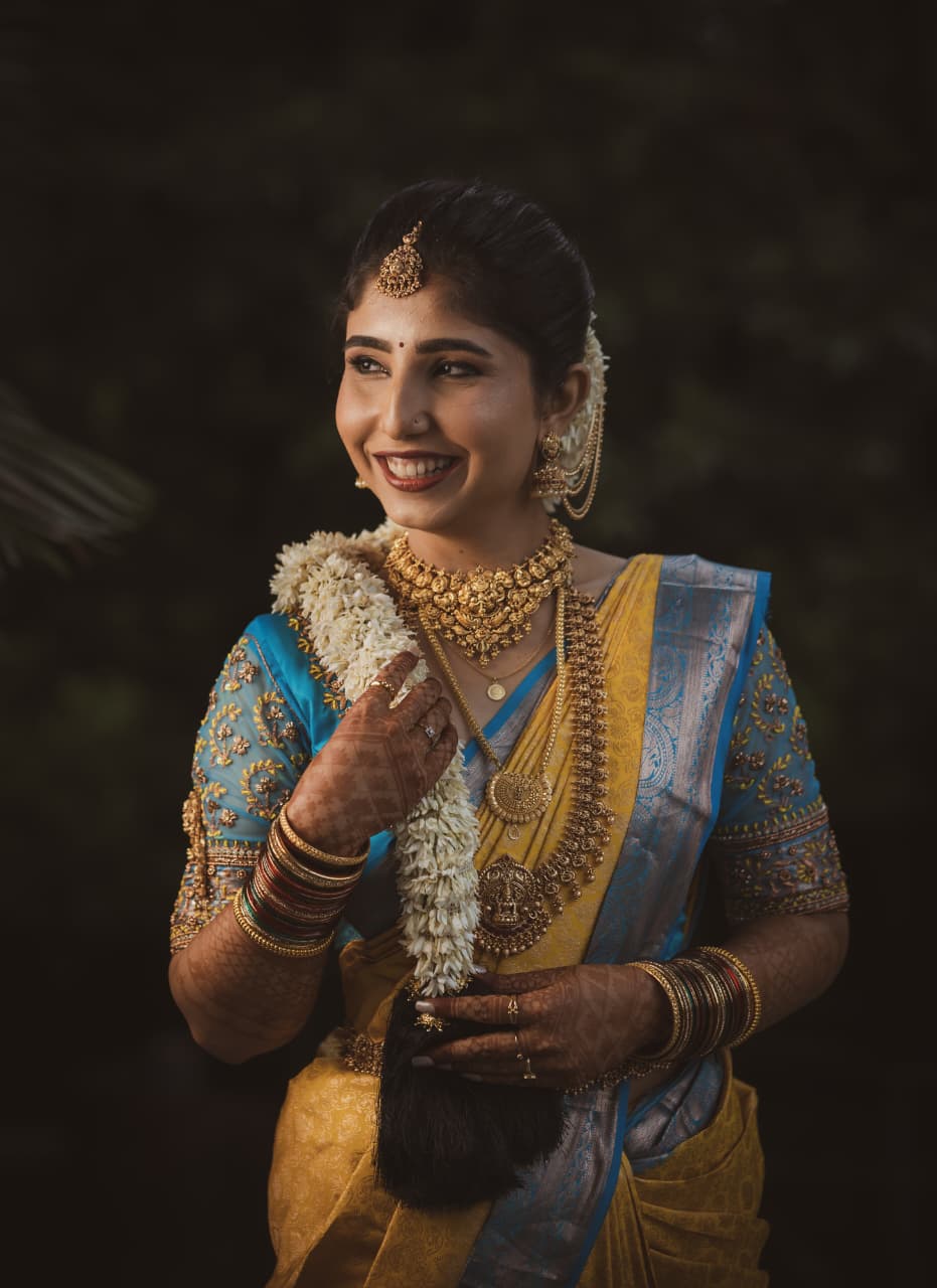 Radiant bride holding white flowers with perfect bridal makeup